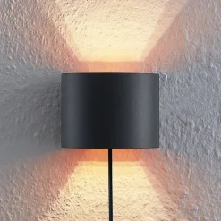 Arcchio væglampe Zuzana, rund, sort, stik, 13 cm