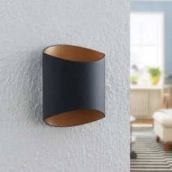 Arcchio Vilja væglampe, sort, guld, oval