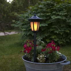 LED-solcellelampe Flame, 4-i-1, sort