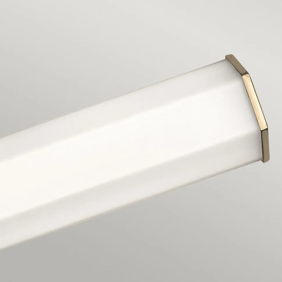 LED-væglampe til badeværelset Facet Dual, messing, 2 lyskilder, bredde 66 cm