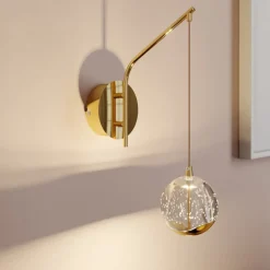 Lucande LED-væglampe Hayley, guldfarvet, glas, 34 cm høj