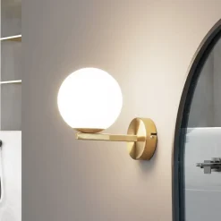 Lucande-væglampe Bidolo, messingfarvet, glas, 12 cm, IP44