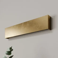 Quitani LED-væglampe Maja, guld antik, bredde 54 cm