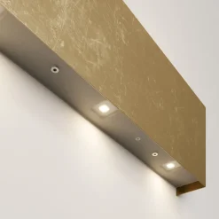 Quitani LED-væglampe Maja, guld antik, bredde 54 cm